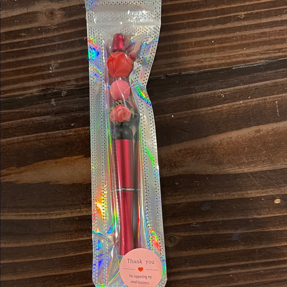 Rose-Themed Red Pen writes black